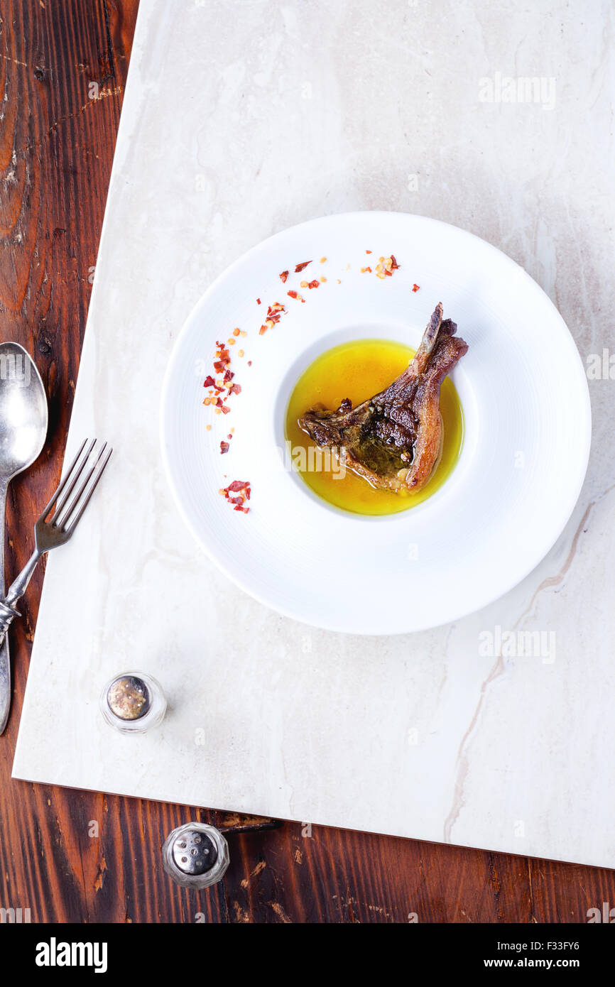 Well done grilled lamb chop Stock Photo Alamy