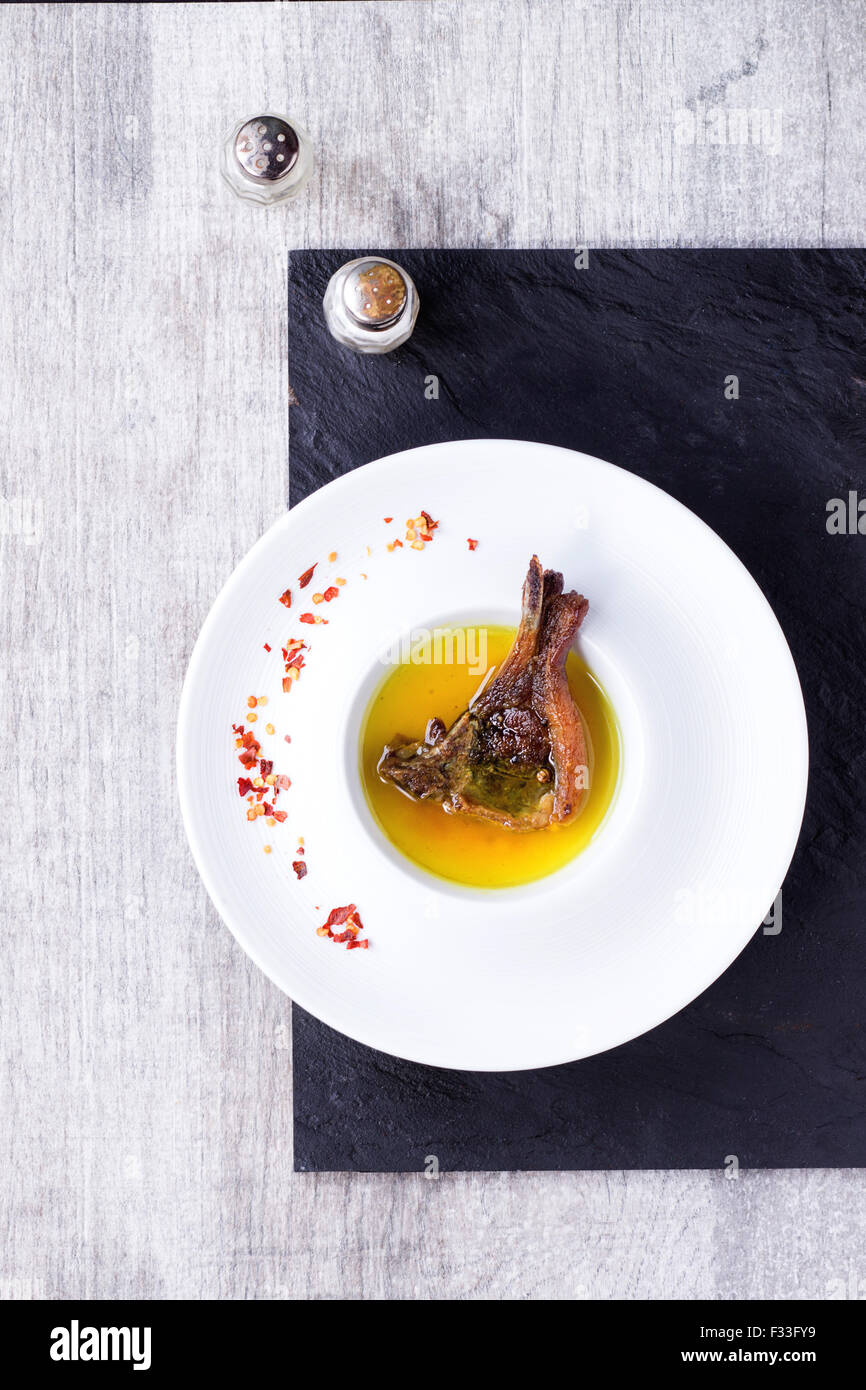 Well done grilled lamb chop Stock Photo Alamy