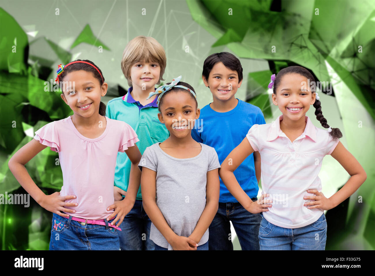 Composite image of cute pupils smiling at camera in classroom Stock ...