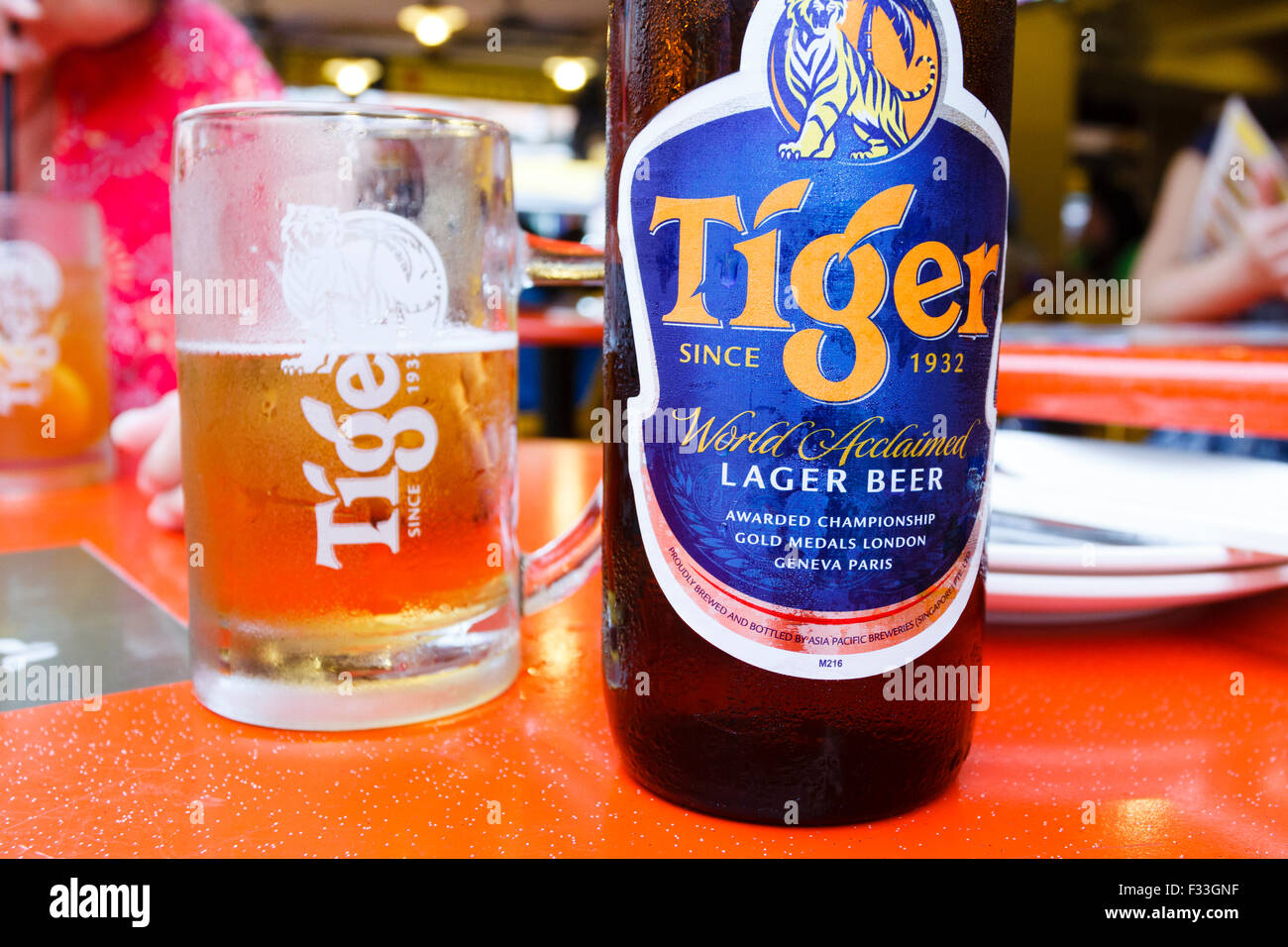 Bottle and glass of Tiger beer, China town, Singapore Stock Photo