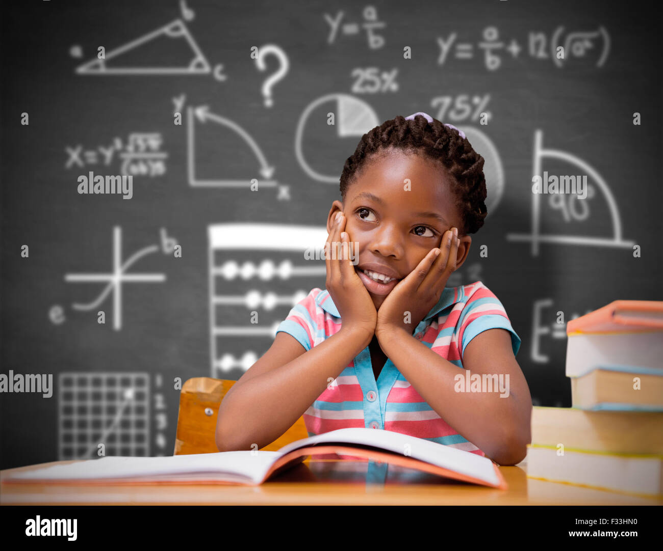 Composite image of pupil sitting at her desk Stock Photo - Alamy