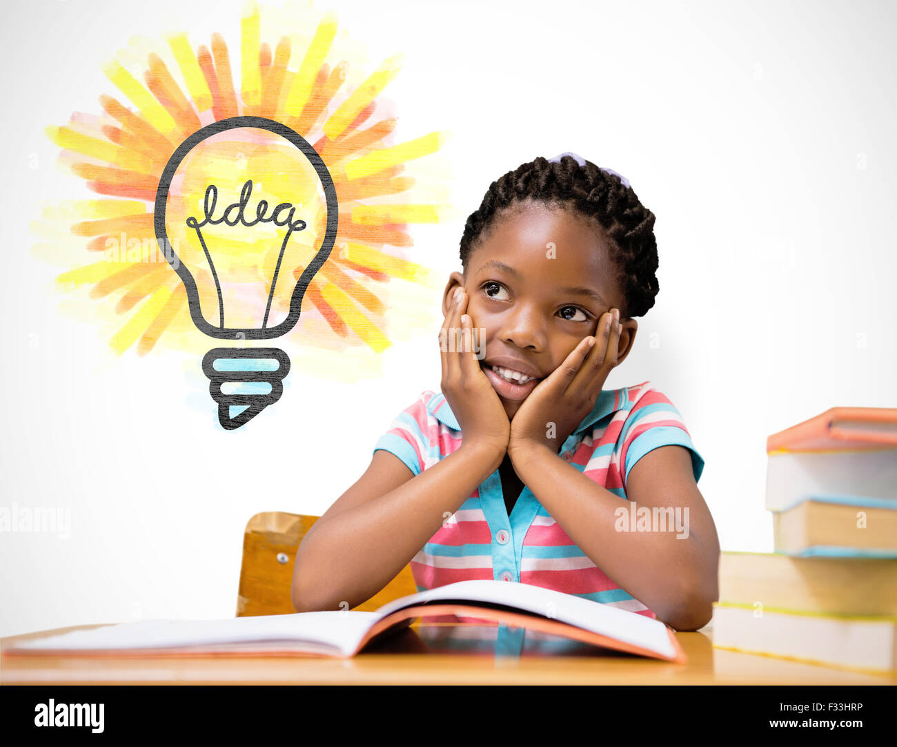 Composite image of pupil sitting at her desk Stock Photo - Alamy