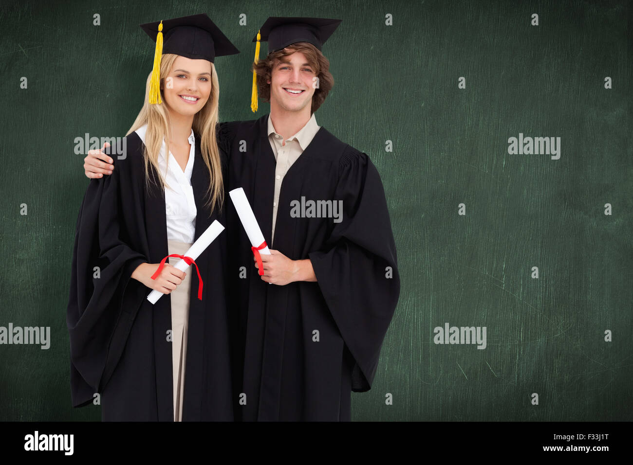 Two graduates holding diploma hi-res stock photography and images - Alamy