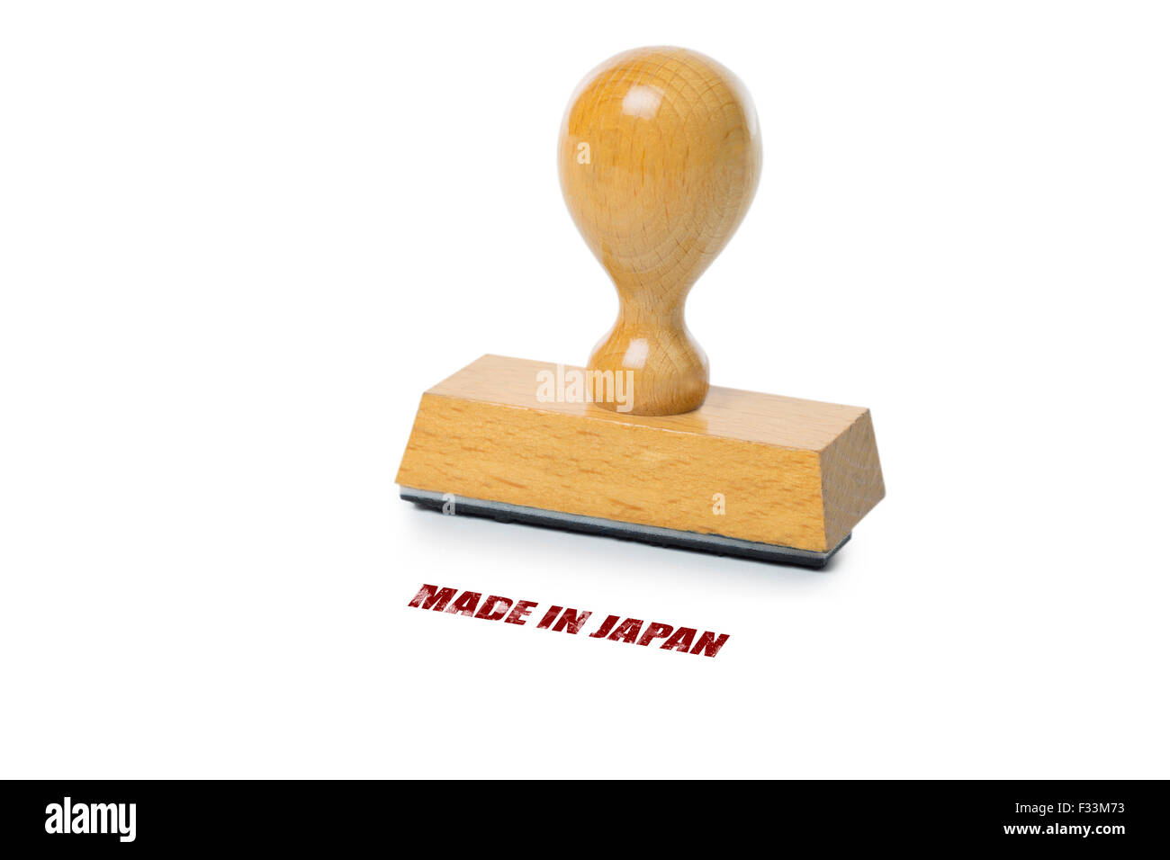 Made in Japan printed in red ink with wooden Rubber stamp isolated on white background Stock Photo