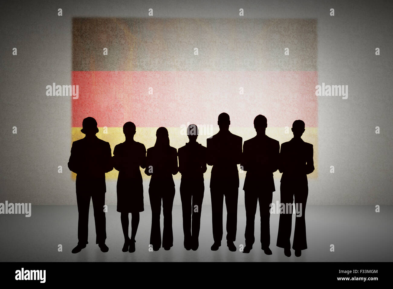 Composite image of silhouette of business people in a row Stock Photo