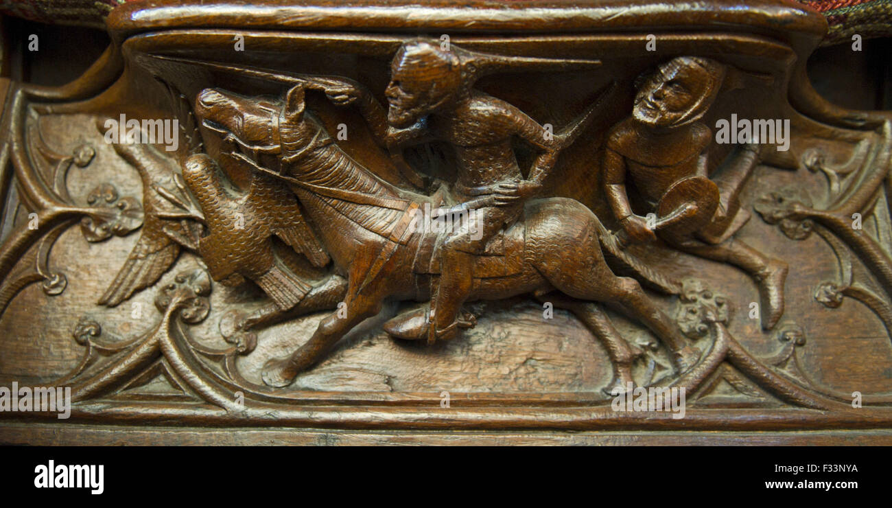 Medieval misericord depicting early falconry or hawking with bird of prey catching a duck Gloucester Cathedral Stock Photo