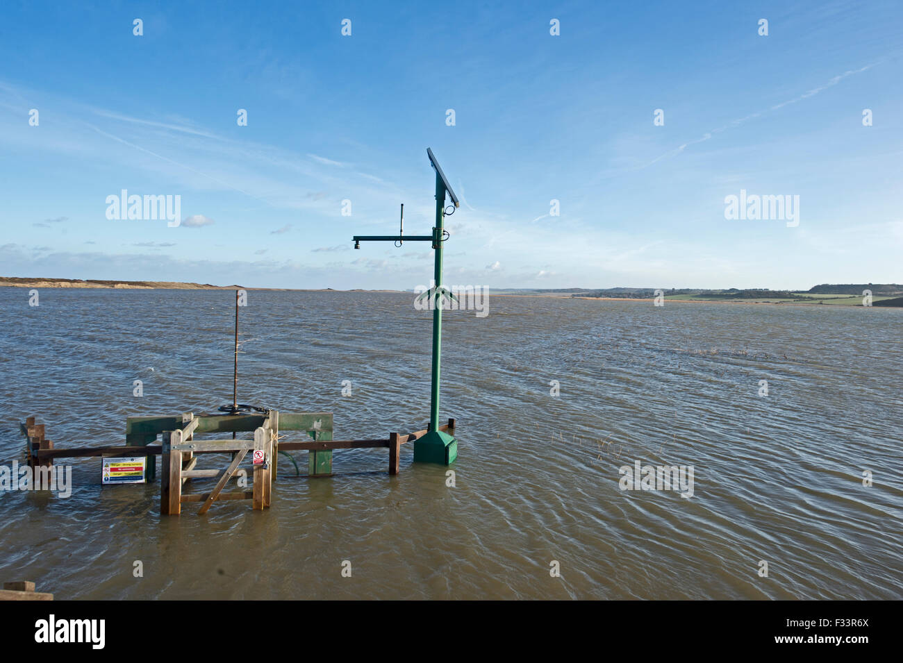 Cley Marshes flooded after storm surge of night of 5 December 2013 Norfolk, view along East Bank Stock Photo