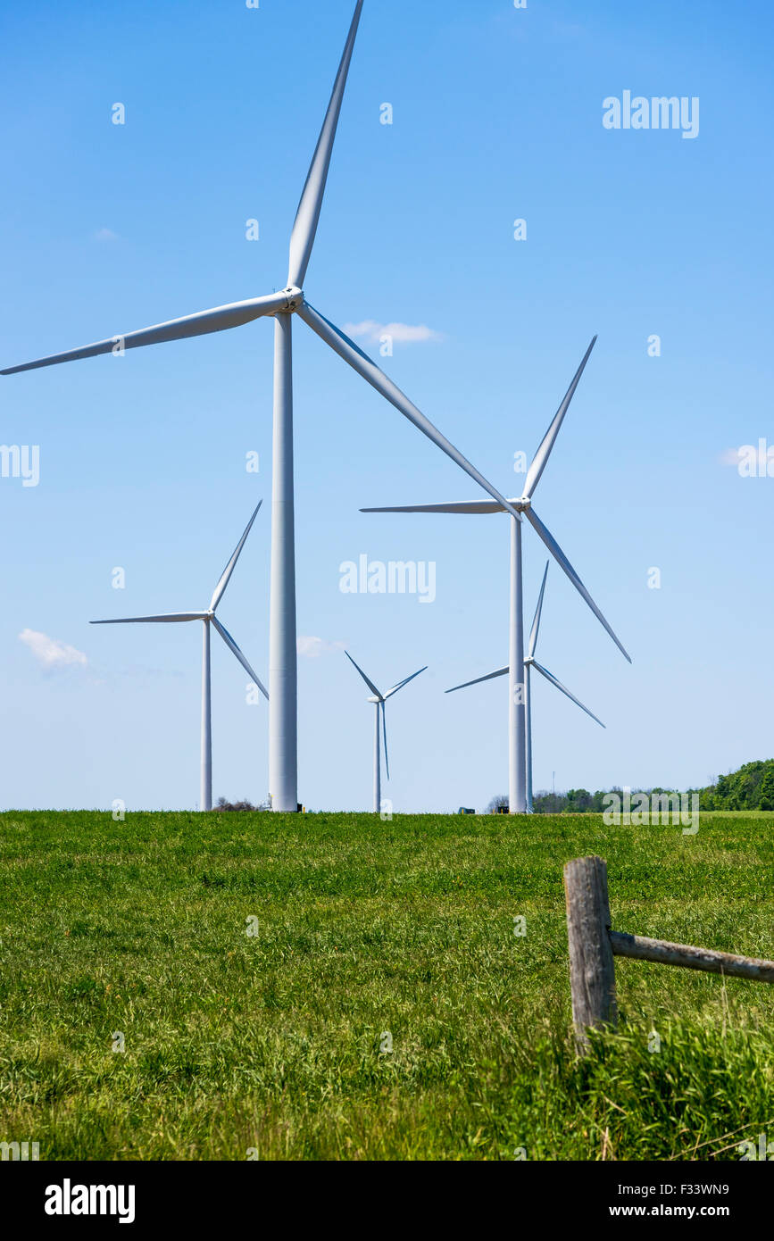 Wind turbines in a green field Wind Farm. Stock Photo