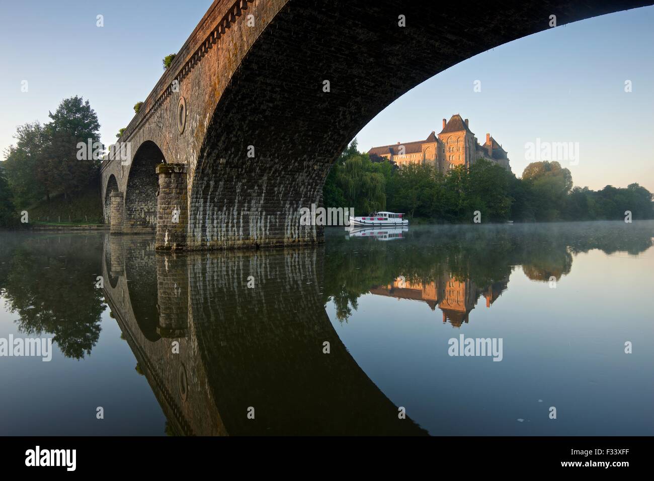 Solesmes abbey reflected into the river sarthe photographed on an still