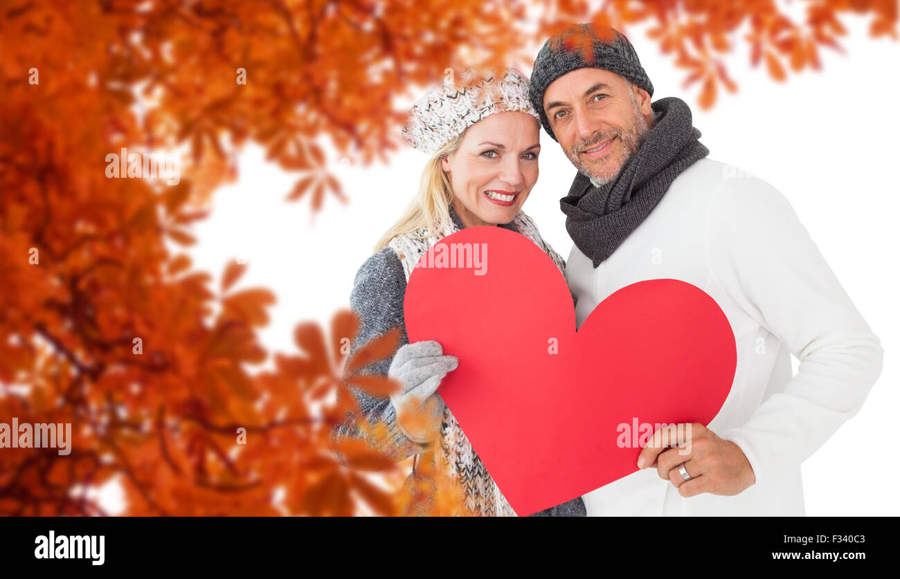 Composite image of portrait of happy couple holding heart Stock Photo ...