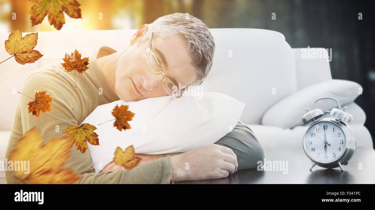 Resting Image Composite image of man resting on cushion Stock Photo - Alamy