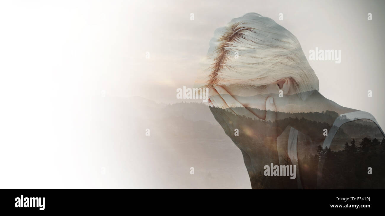 Composite image of sad blonde woman crying with head on hands Stock ...