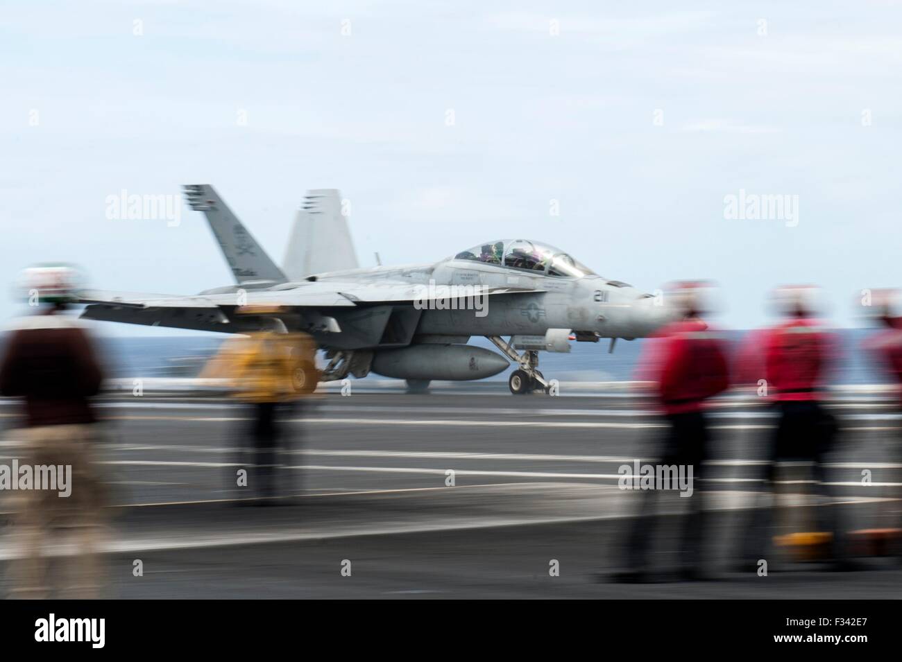 A US Navy F/A-18F Super Hornet fighter aircraft launches from the flight deck of the aircraft carrier USS Harry S. Truman September 15, 2015 operating in the Atlantic Ocean. Stock Photo