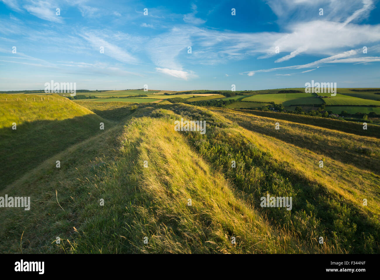 the western ramparts of Maiden Castle, an Iron Age hill fort near Dorchester, Dorset, England, UK Stock Photo