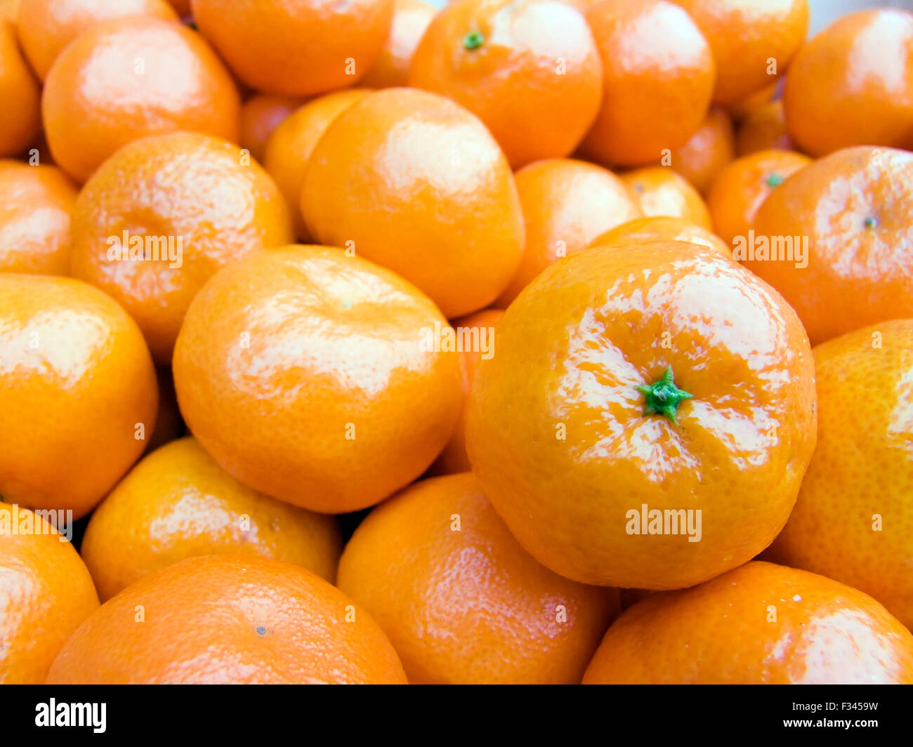 The beautiful mandarines on a counter, fruit background close up Stock Photo