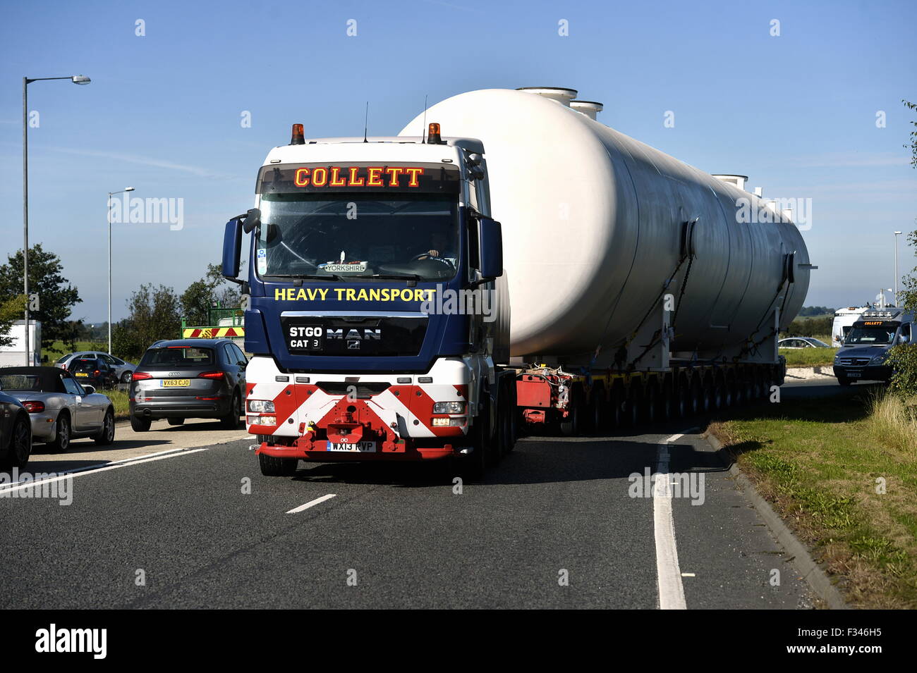 Kingstown, Carlisle, UK. 29th September, 2015. A pressure vessel weighing approximately 130 ton and measuring 27 metres long is transported from Bendalls Engineering, Kingstown, Carlisle. The abnormal load which measured a total of 40 metres long was hauled by Yorkshire heavy transport company Collett Transport to the Port of Blyth where it will be shipped to to the customer in Azerbaijan. Once there it will be installed as part of the expansion to BP's Shar Deniz terminal. This is the final part of the export order of 26 vessels. Credit:  STUART WALKER/Alamy Live News Stock Photo