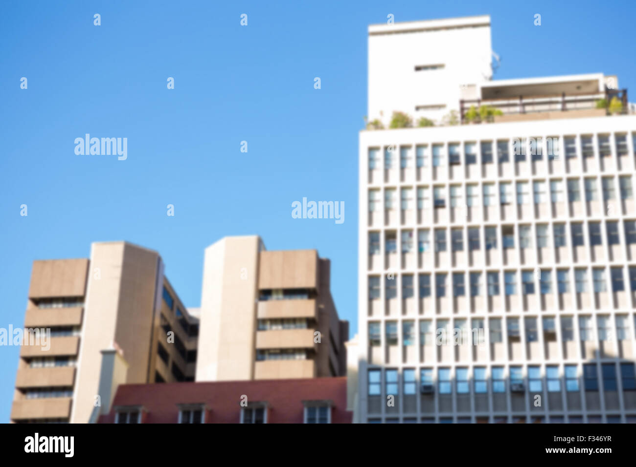 Large buildings against blue sky Stock Photo - Alamy