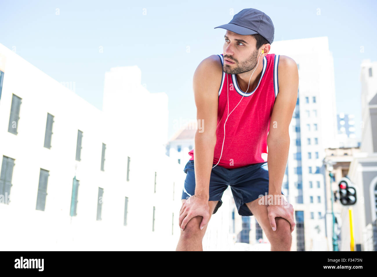 Exhausted athlete leaning forward after an effort Stock Photo Alamy