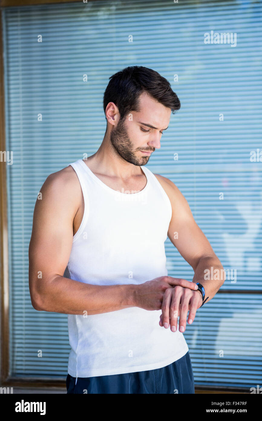 Handsome athlete checking heart rate watch Stock Photo Alamy