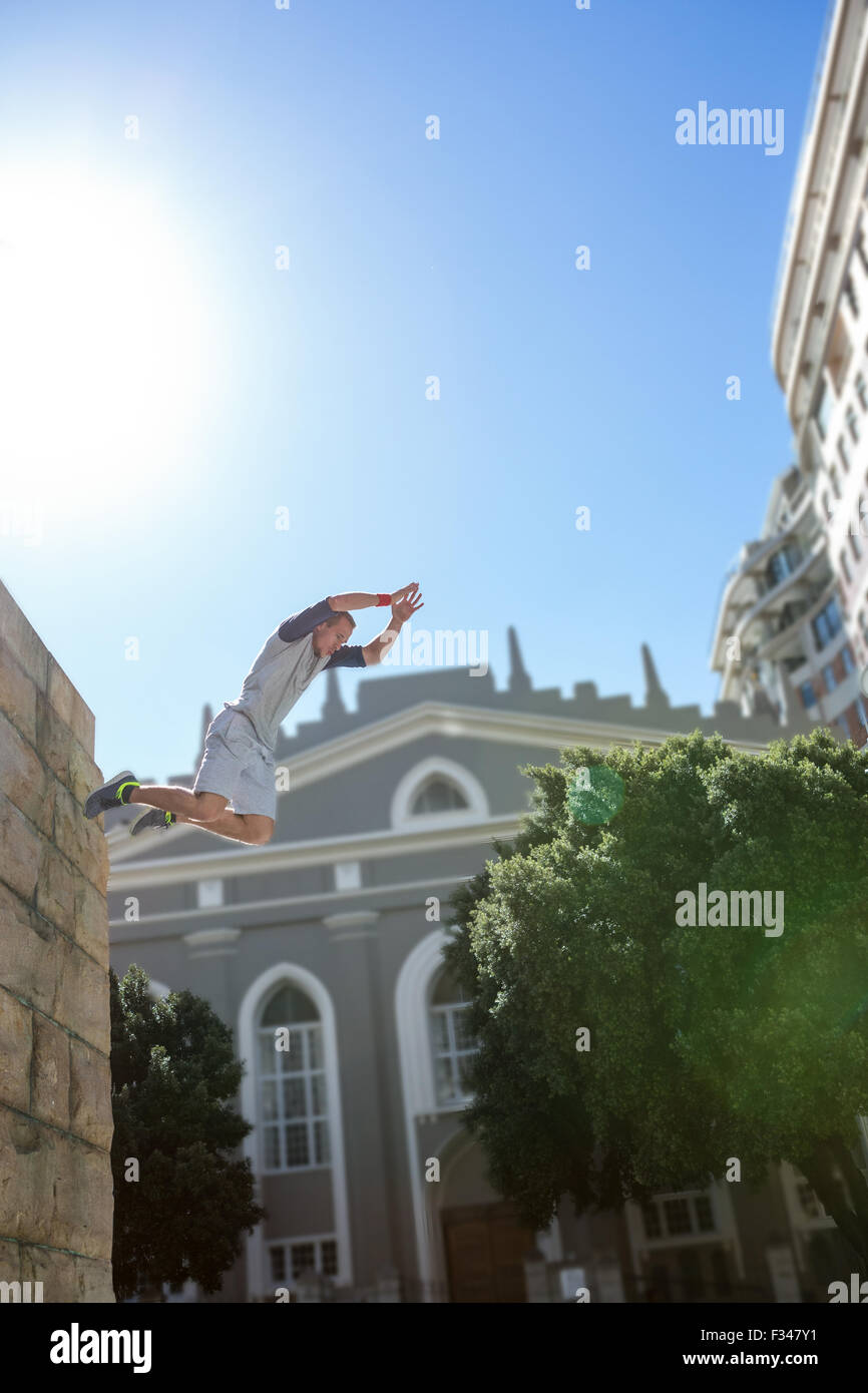 Man doing parkour in the city Stock Photo