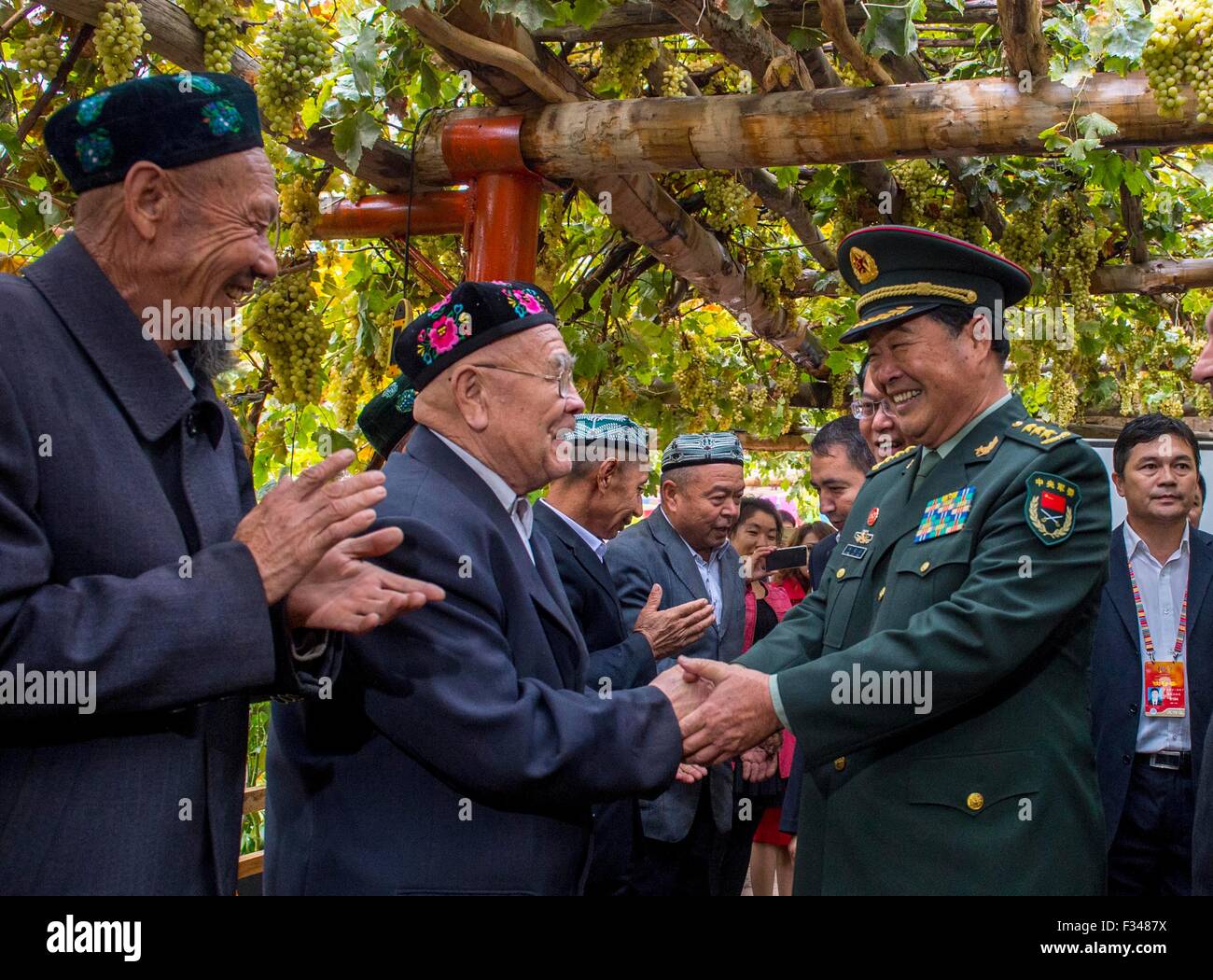 Turpan, China's Xinjiang Uygur Autonomous Region. 29th Sep, 2015. Zhao Keshi (R, front), head of PLA's General Logistics Department, visits local residents in Turpan, northwest China's Xinjiang Uygur Autonomous Region, Sept. 29, 2015. © Jiang Wenyao/Xinhua/Alamy Live News Stock Photo