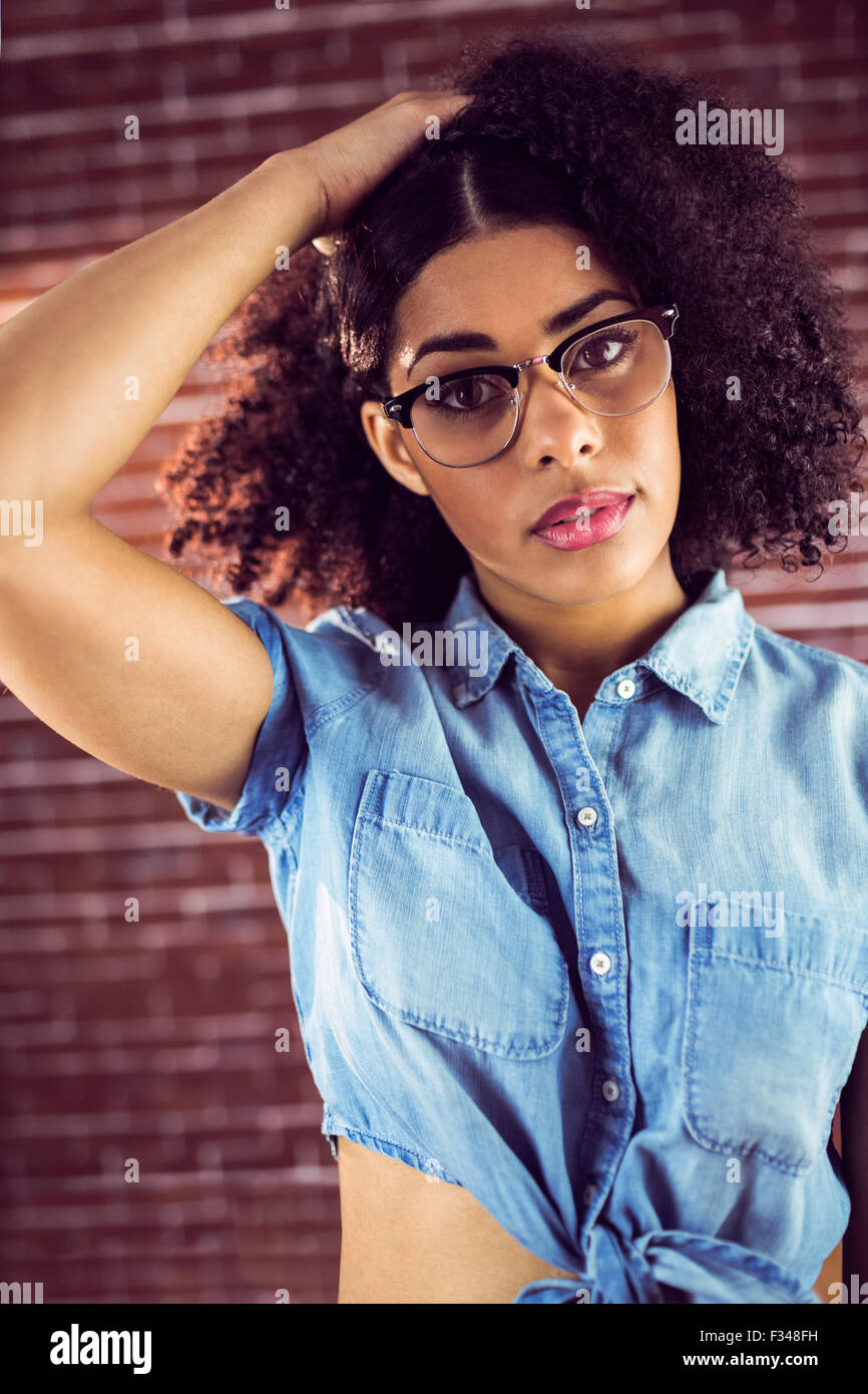 Attractive hipster holding hair back Stock Photo