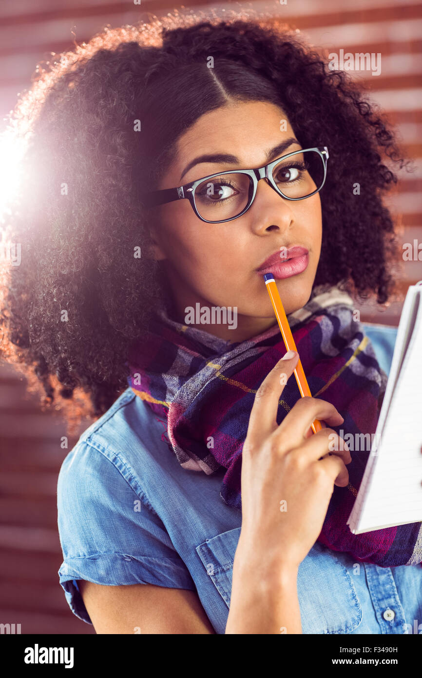 Taking Notes Hamostr Attractive focused hipster taking notes Stock Photo - Alamy