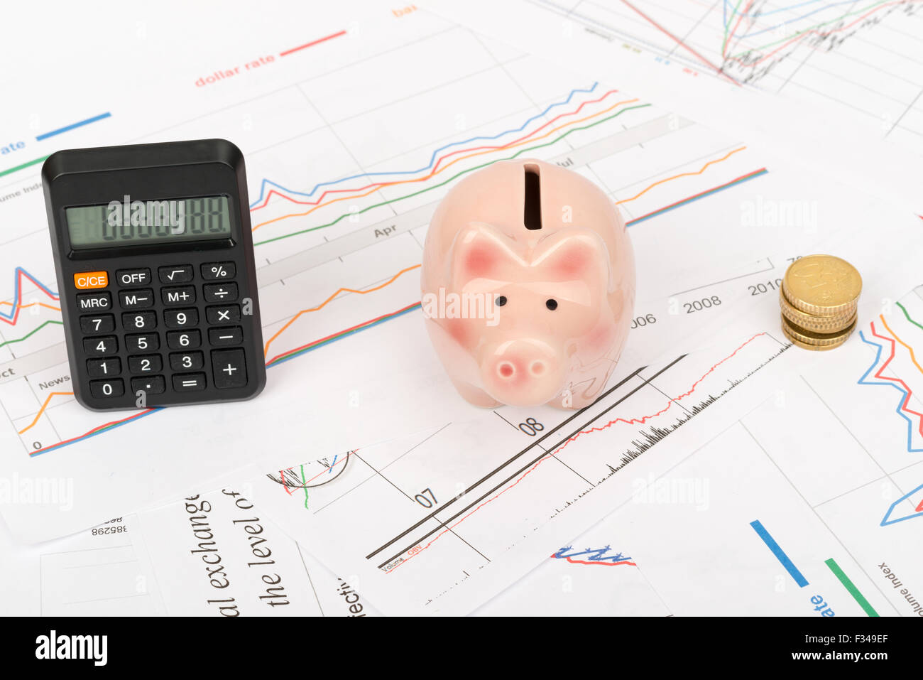 Piggy bank with calculator, top view Stock Photo - Alamy