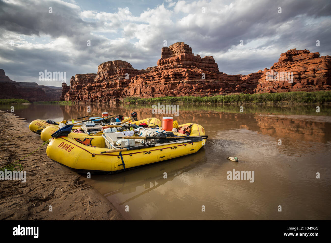 Rafts parked on the shore of a river in a desert landscape Stock Photo ...