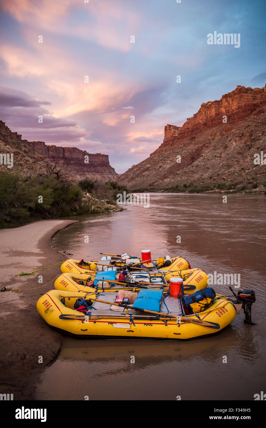 Shore Raft Inflatable rafts sit on the shore at sunset along a river Stock Photo ...