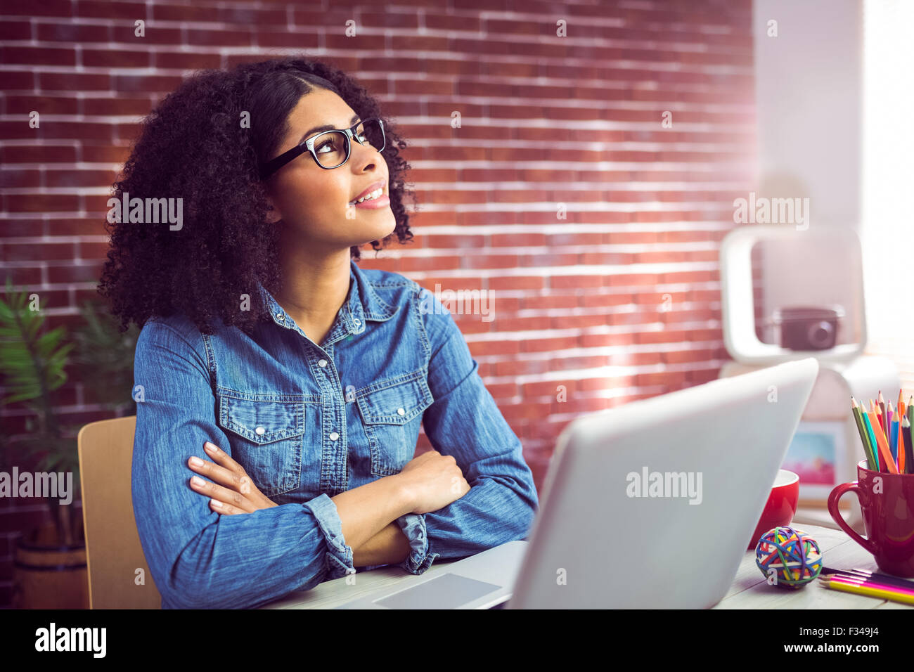 Casual businesswoman day dreaming Stock Photo