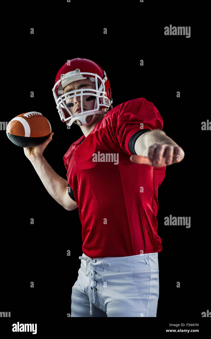 American football player throwing football Stock Photo Alamy
