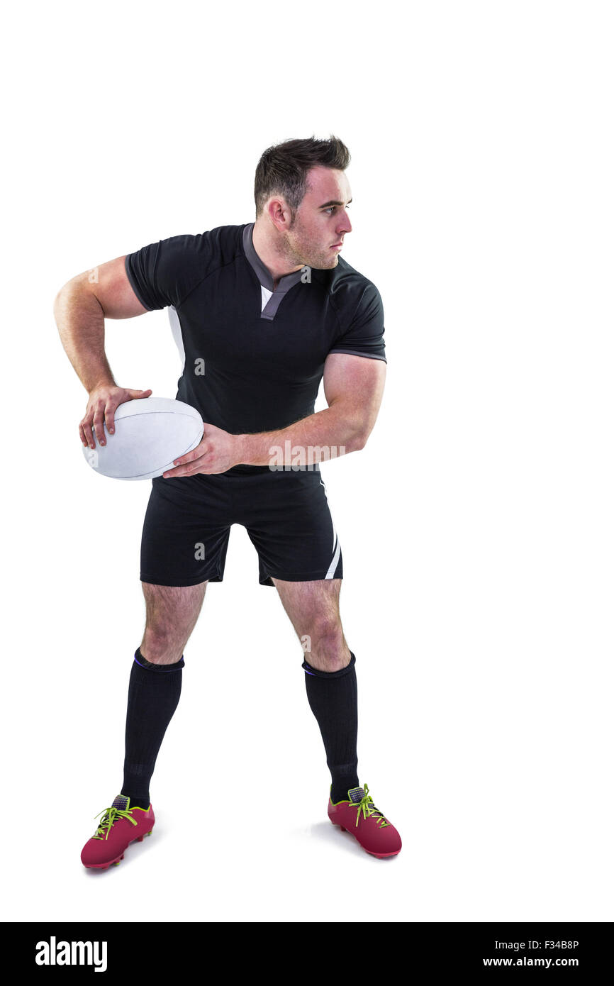 Rugby player throwing the ball Stock Photo