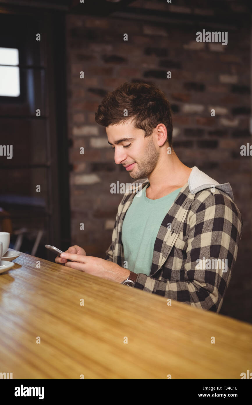 Smiling hipster sitting and texting Stock Photo Alamy