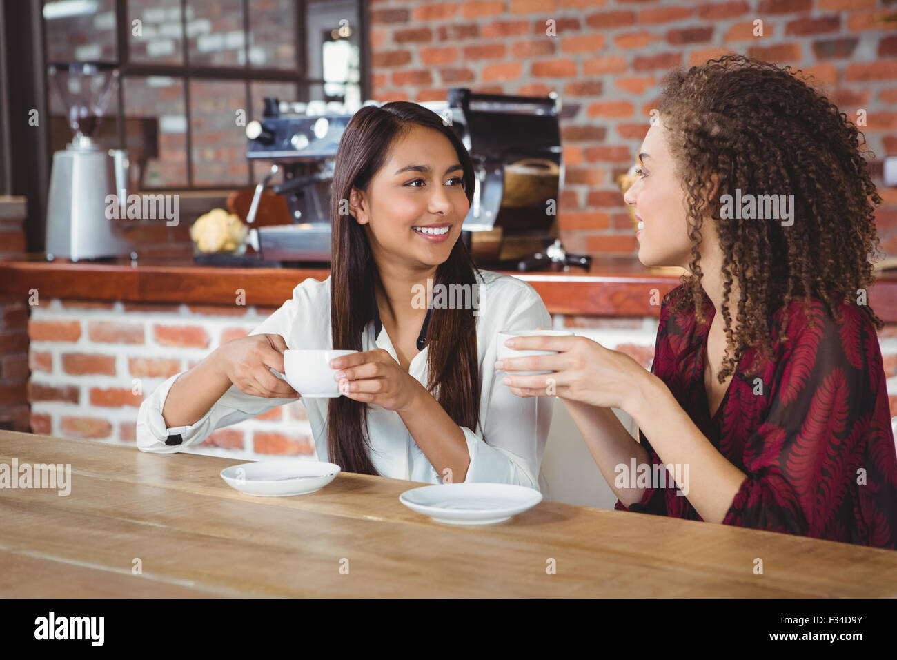 Female friends having coffee Stock Photo
