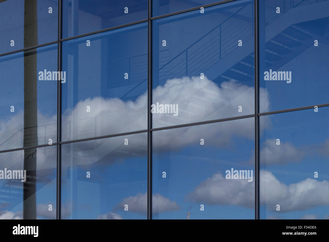 blue sky and clouds reflection in office building window Stock Photo ...