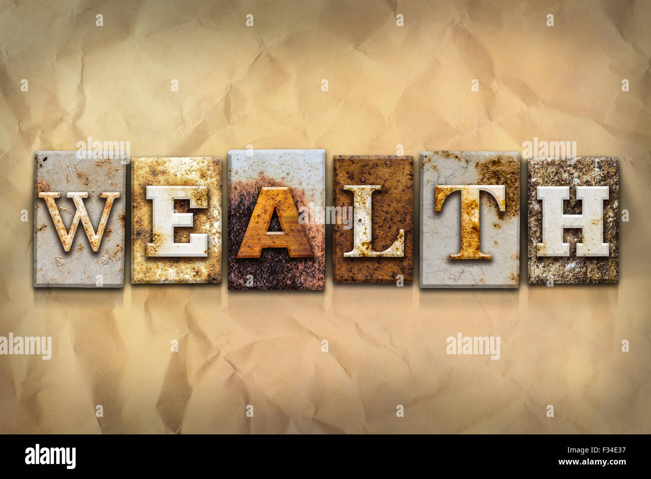 The Word WEALTH Written In Rusty Metal Letterpress Type On A Crumbled Aged Paper Background