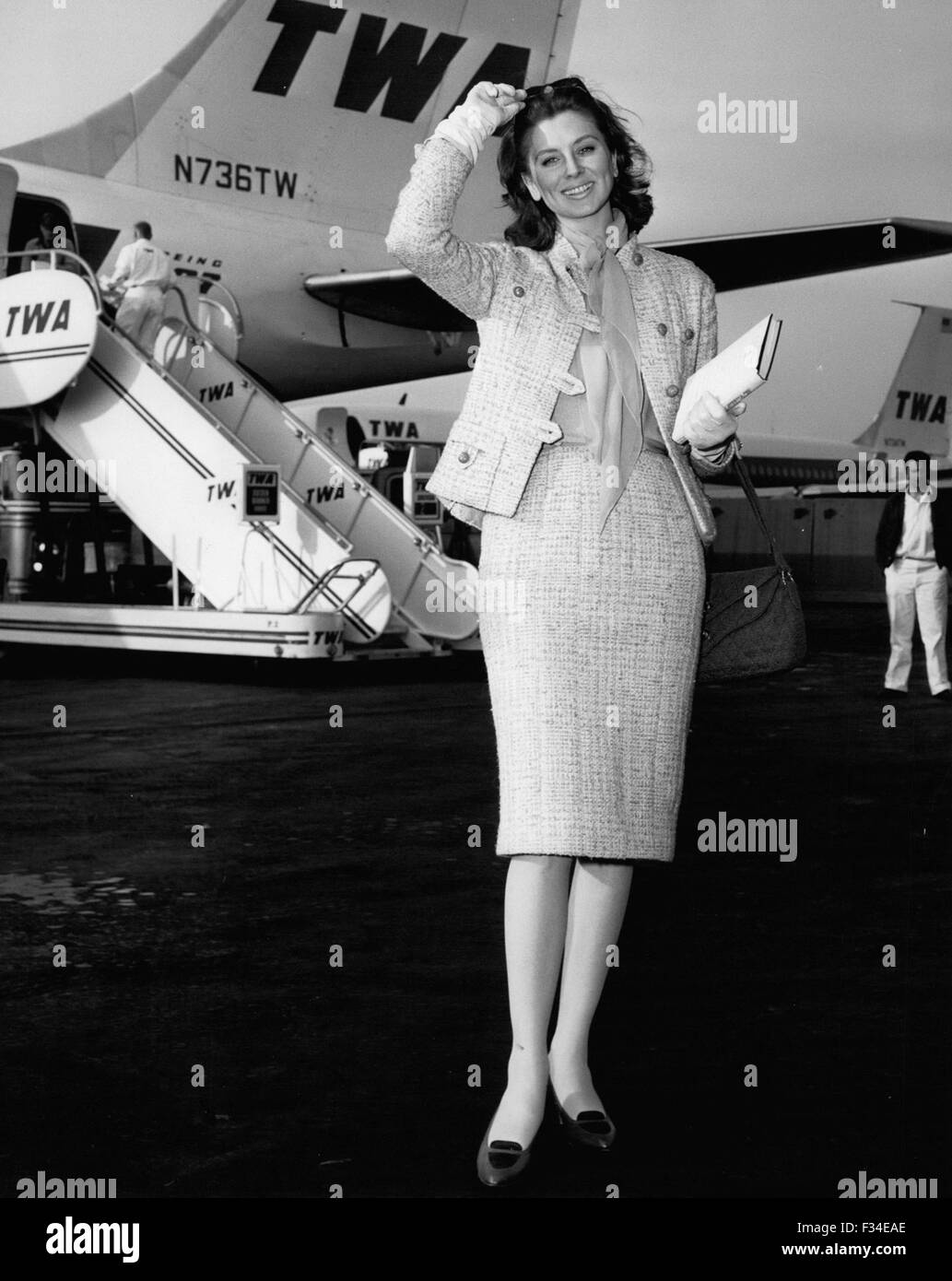 Dec. 20, 1976 - Idlewild Airport, N.Y., May 12 - Glamourous scree star and model Suzy Parker graces the airport scene on her arrival via TWA's Boeing 707 jet liner from Los Angeles. Miss Parker is in town to start location shooting for her latest movie ''The Best of Everything'' produced by Jerry Wald. (Credit Image: © Keystone Pictures USA/ZUMAPRESS.com) Stock Photo