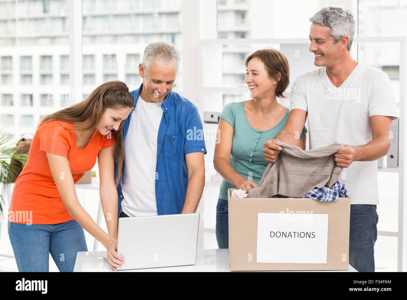 Casual business people sorting donations Stock Photo
