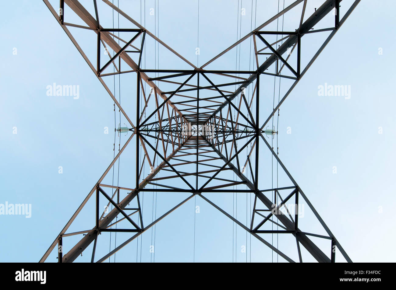 A symmetrical upward facing shot of a UK electricity pylon. Stock Photo