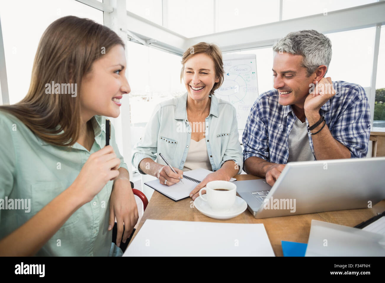 Casual business people speaking together Stock Photo
