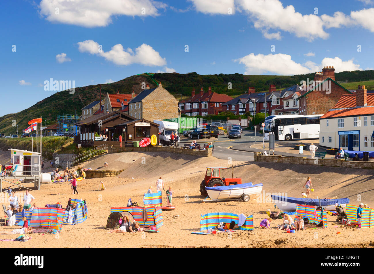 Lots of families enjoying the summer on Sandsend beach, England Stock Photo