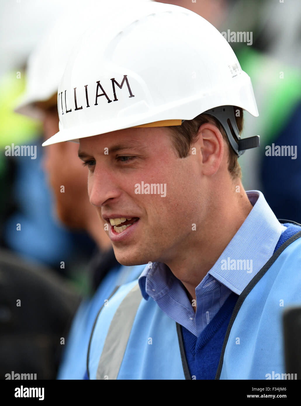The Duke of Cambridge Prince William wears an hard hat on a visit to a