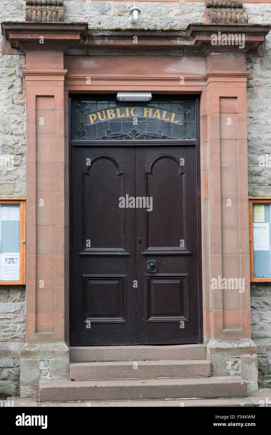 Black double doors firmly closed shut at a public hall in Pooley Bridge near Penrith, Cumbria Stock Photo