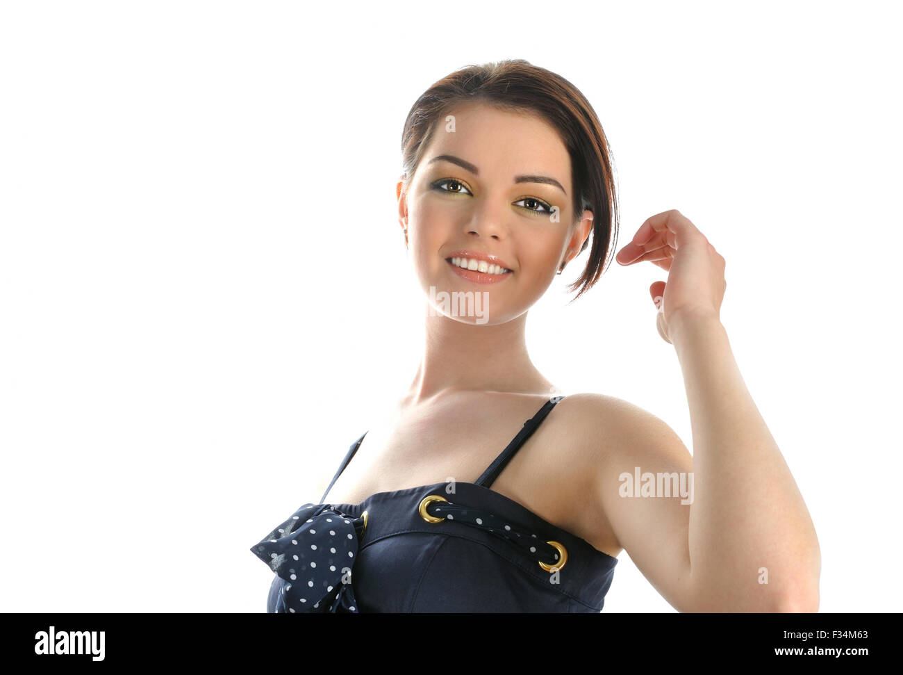 Portrait of young smiling brunette girl on white background Stock Photo ...