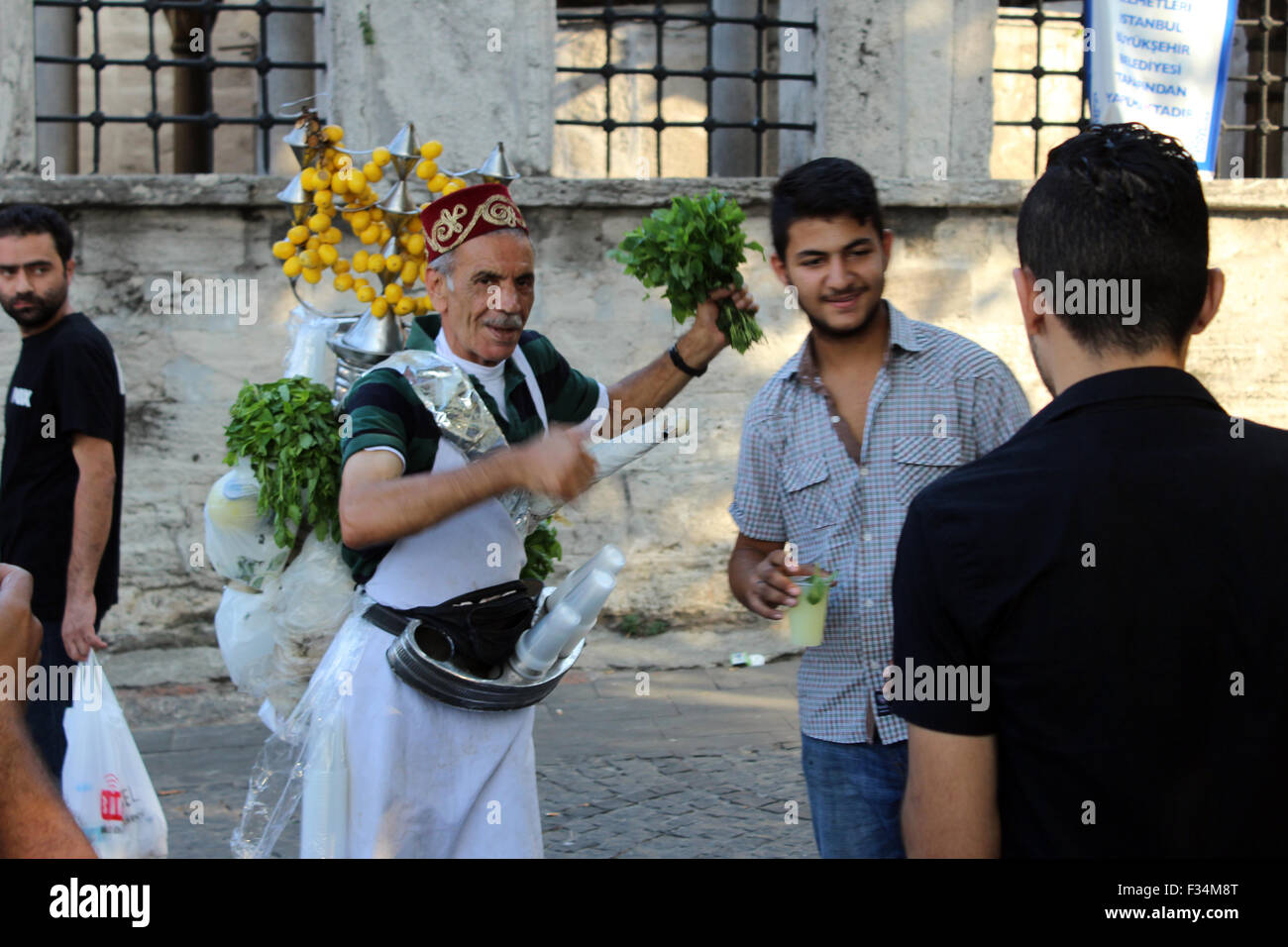 Istanbul, Turkey - September 20, 2015: seller of lemonade poses for the camera in the hands of with parsley Stock Photo