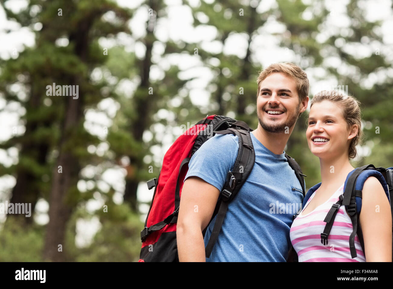 Young happy hikers looking in the distance Stock Photo - Alamy