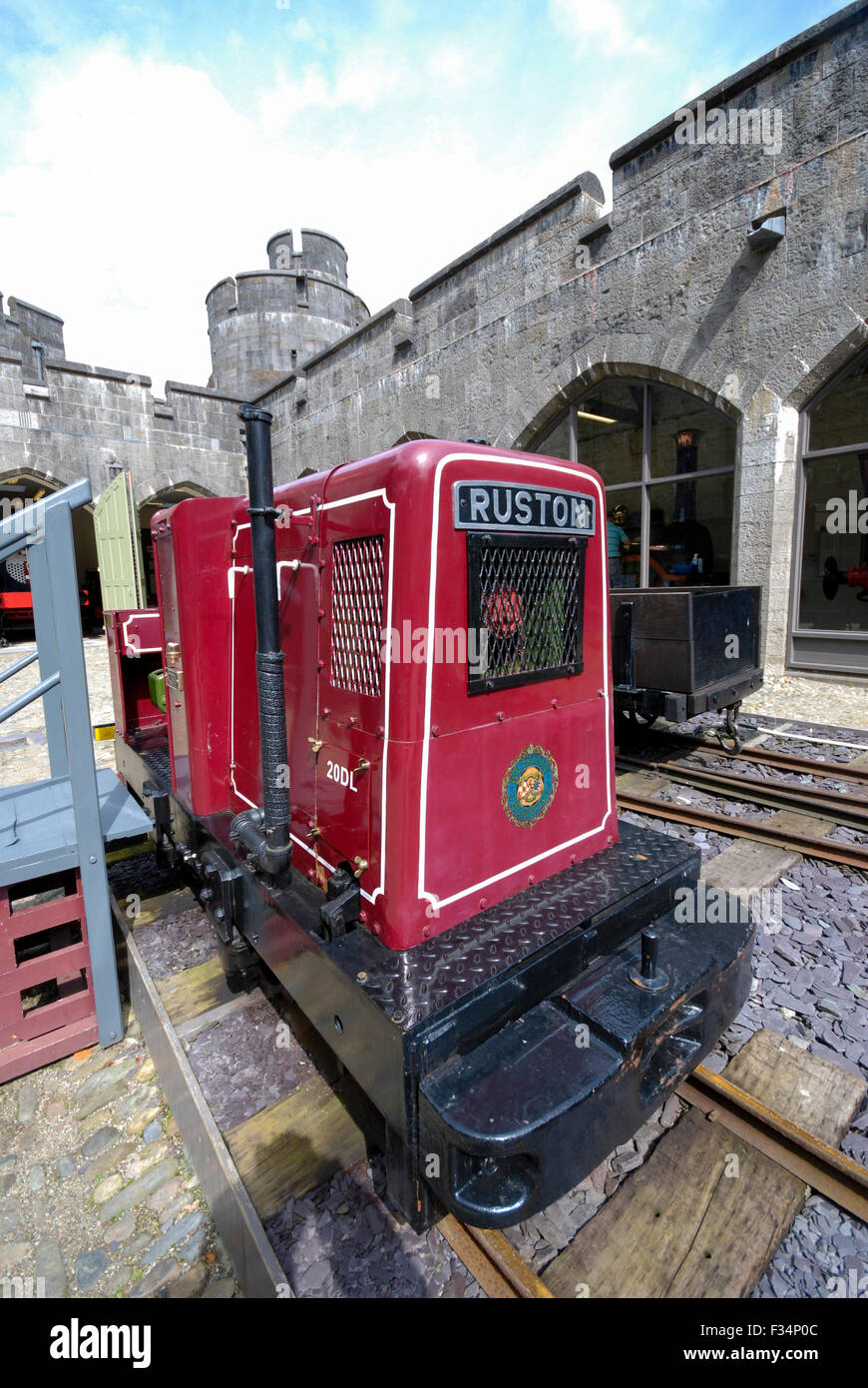 A historic Ruston 2 cylynder narrow gauge diesel locomotive used for hauling slate. The small train engine is on display at Penrhyn Castle in Wales Stock Photo