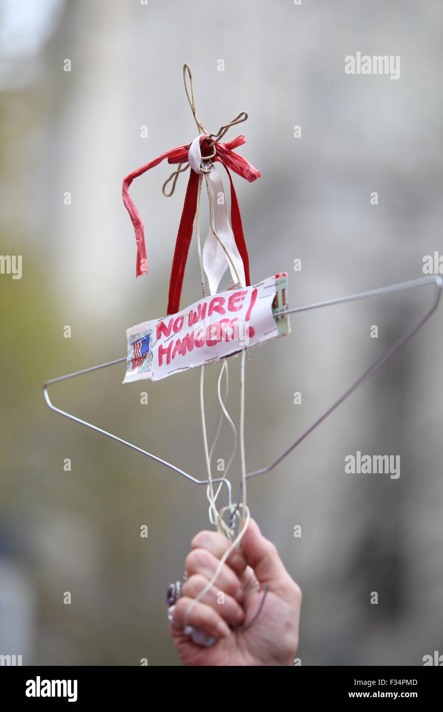 New York City, United States. 29th Sep, 2015. Stylized coat hanger held  aloft to symbolize times when abortion services were illegal. Activists and  directors of Planned Parenthood, NYC, gathered in Foley Square