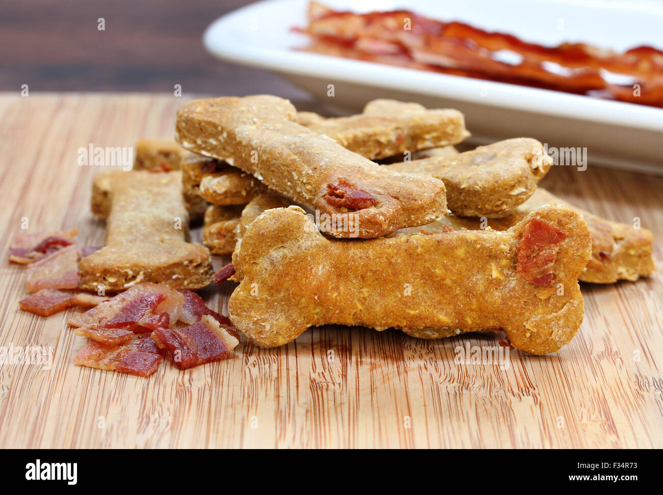 Pumpkin, bacon dog biscuits on a cutting board. A homemade and healthy